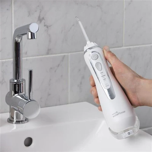 Зубная щетка Ирригатор Waterpik Cordless Advanced Water Flosser White WP-560: Технология чистки струи