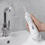 Зубная щетка Ирригатор Waterpik Cordless Advanced Water Flosser White WP-560: Технология чистки струи