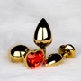 Металлическая анальная пробка Ouch! Heart Gem Gold - Ruby Red, S
