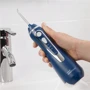 Зубная щетка Ирригатор Waterpik Cordless Advanced Water Flosser Blue WP-563: Технология чистки струи