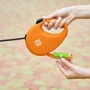 Повідець-рулетка для собак WAUDOG R-leash з контейнером для пакетів L помаранчевий до 40 кг 5 м (26294) фото 5